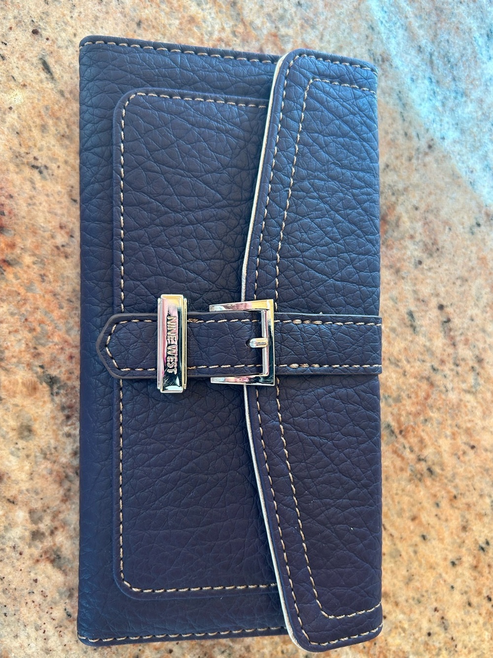 Nine West Deep Blue Trifold Wallet 8”x4” 
4 interior Bill slots/ 16 card slots
